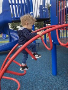 kid playing at the play ground