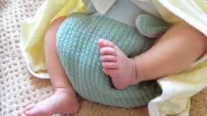 baby wearing cloth diaper