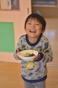 boy holding lunch